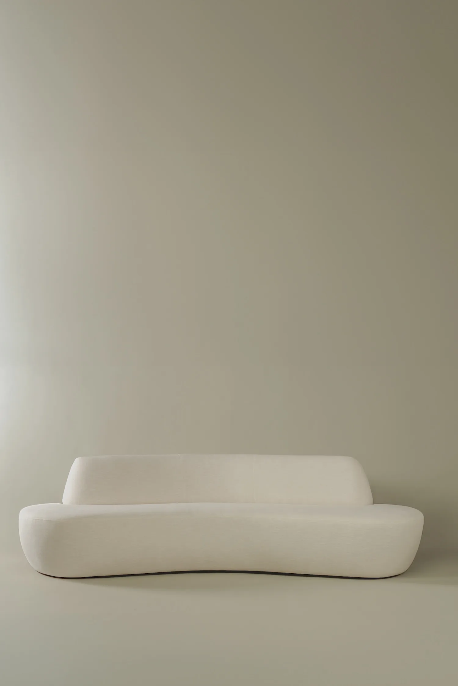 Bodille sofa with soft curves and a sculptural silhouette.