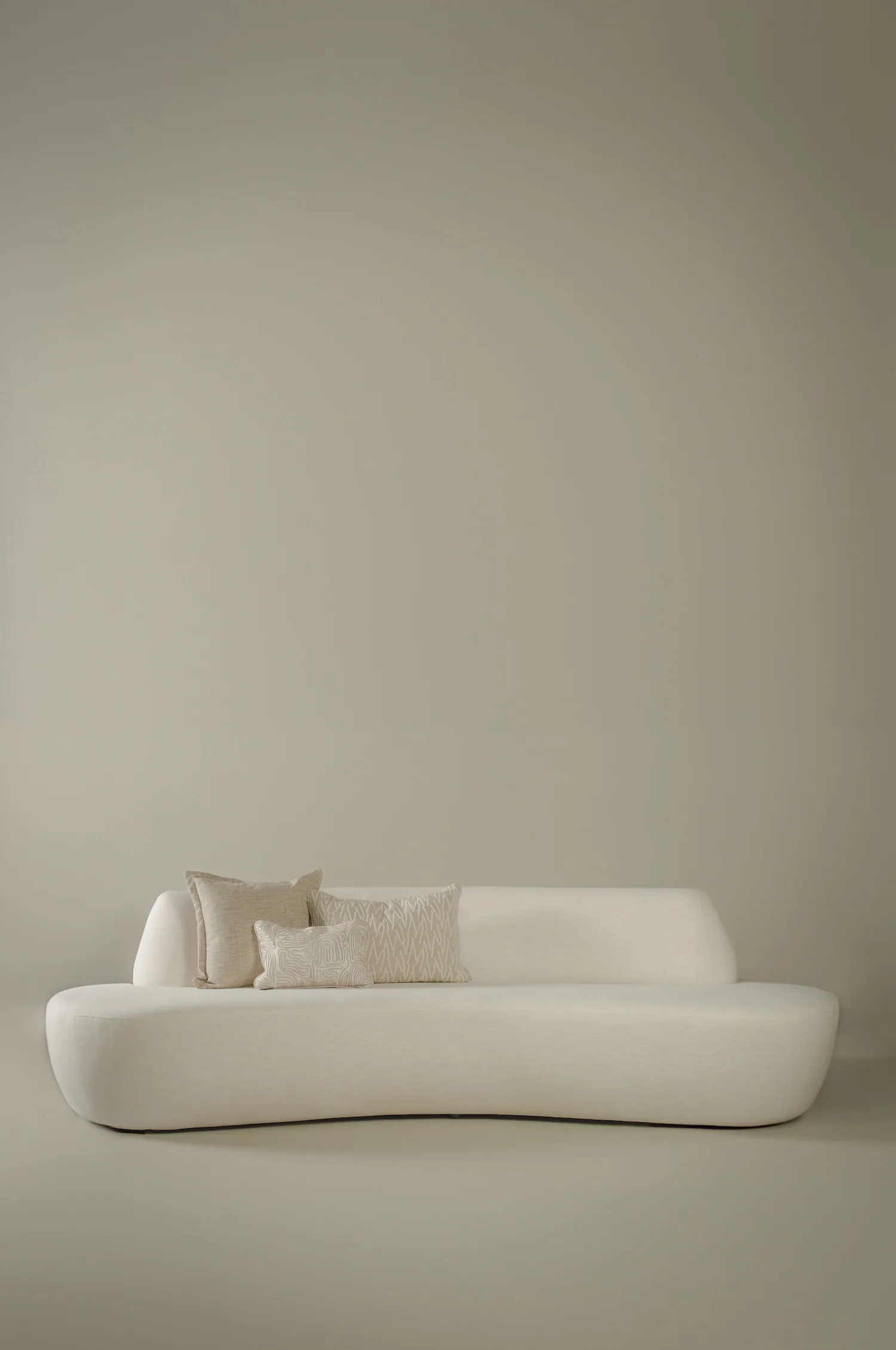 Bodille sofa styled with three textured neutral throw pillows.