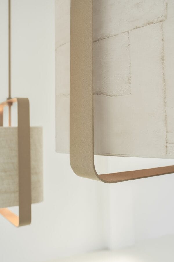 Close-up of a Lora Ceiling Light showing its layered, textured fabric shade and soft gold-toned frame.