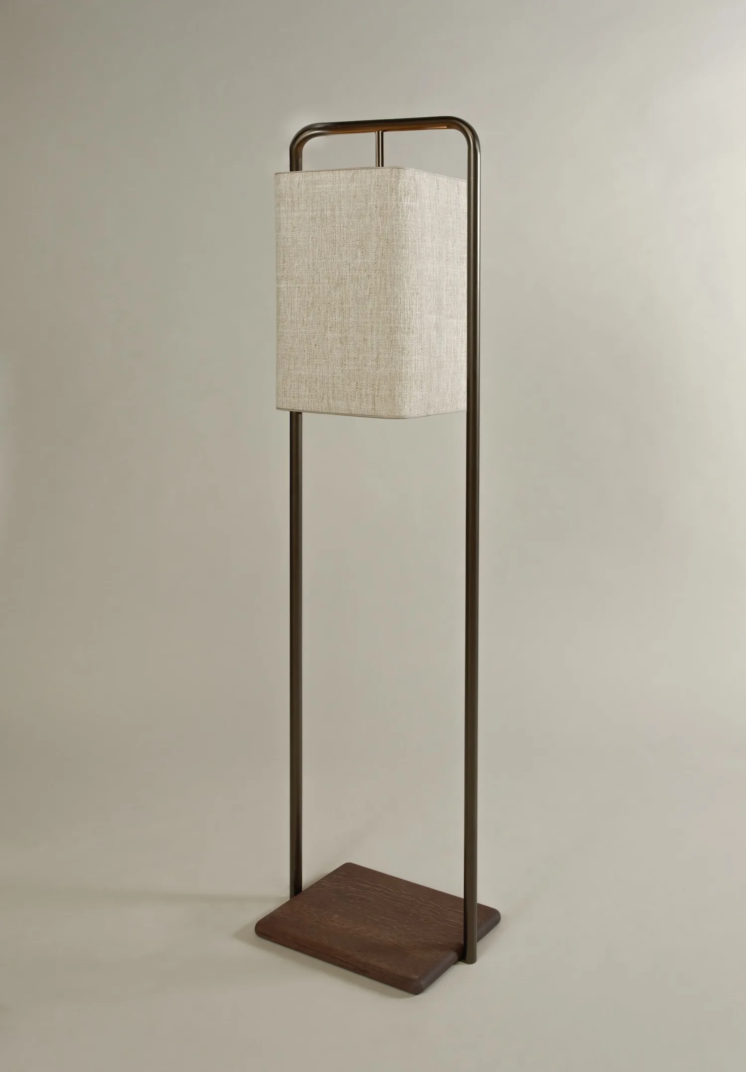 Angled view of the Lora floor lamp showcasing the square shade and minimal metal structure.