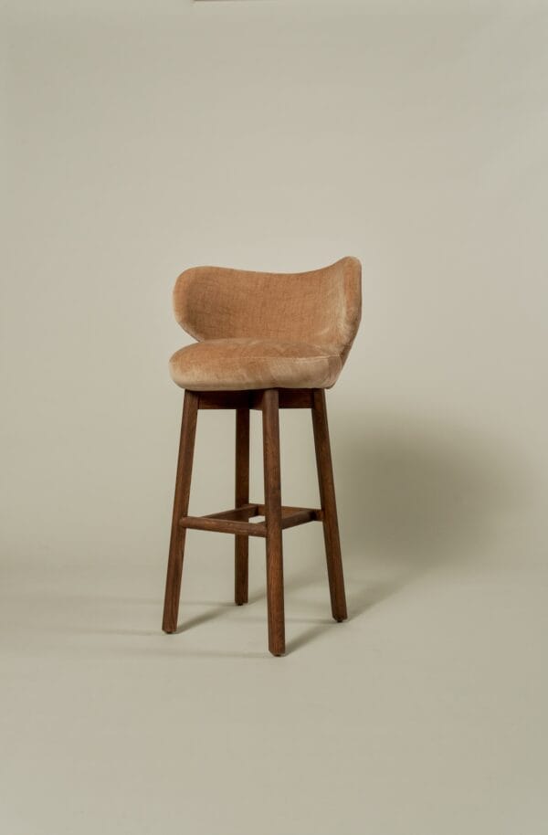 Full view of a terracotta velvet Margaux barstool with walnut-toned legs.