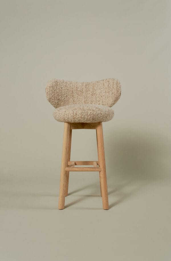 Margaux barstool upholstered in boucle fabric with light oak legs, front view.