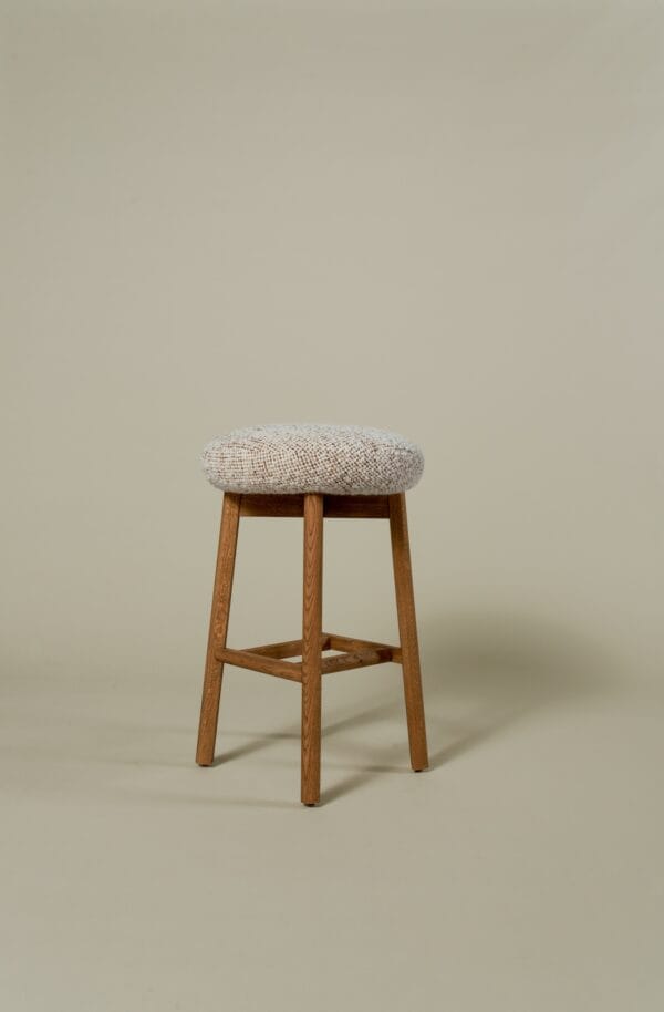 Margaux barstool featuring a rounded boucle seat and warm oak frame.