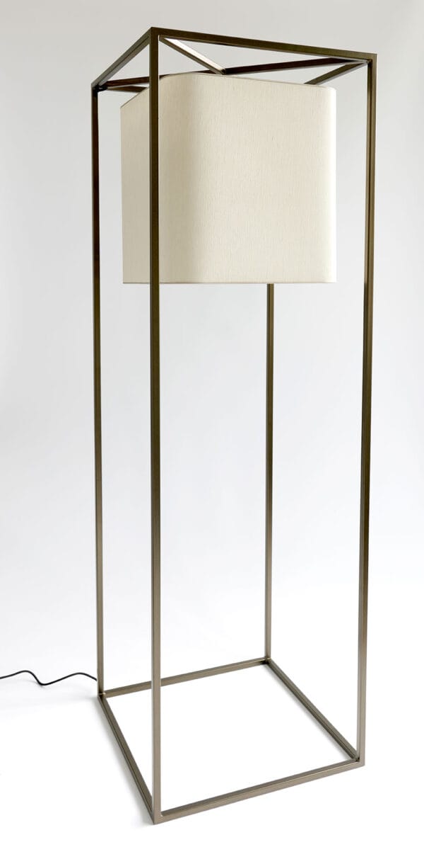 Noa floor lamp with a rounded square shade framed by a tall open cube structure on a white background.