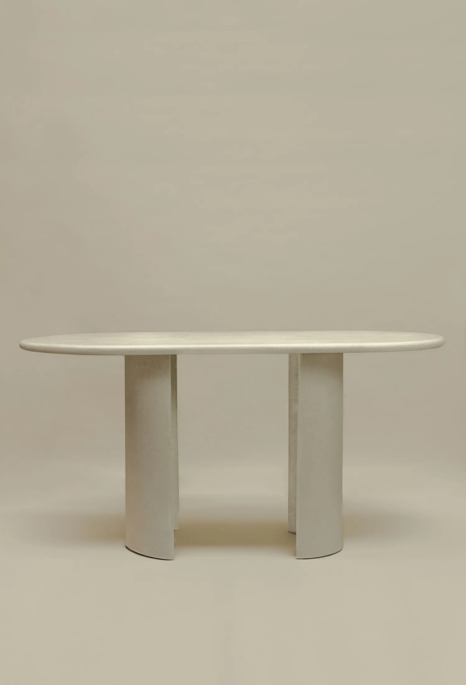 Front view of the Seine bar dining table with arched legs and an elongated oval top.