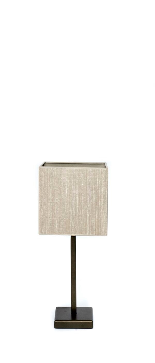 Single table lamp with a short dark base and a light beige square shade.