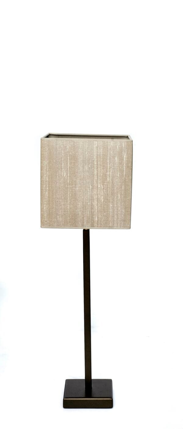 Medium-height table lamp with a minimalist metal base and neutral fabric square shade.