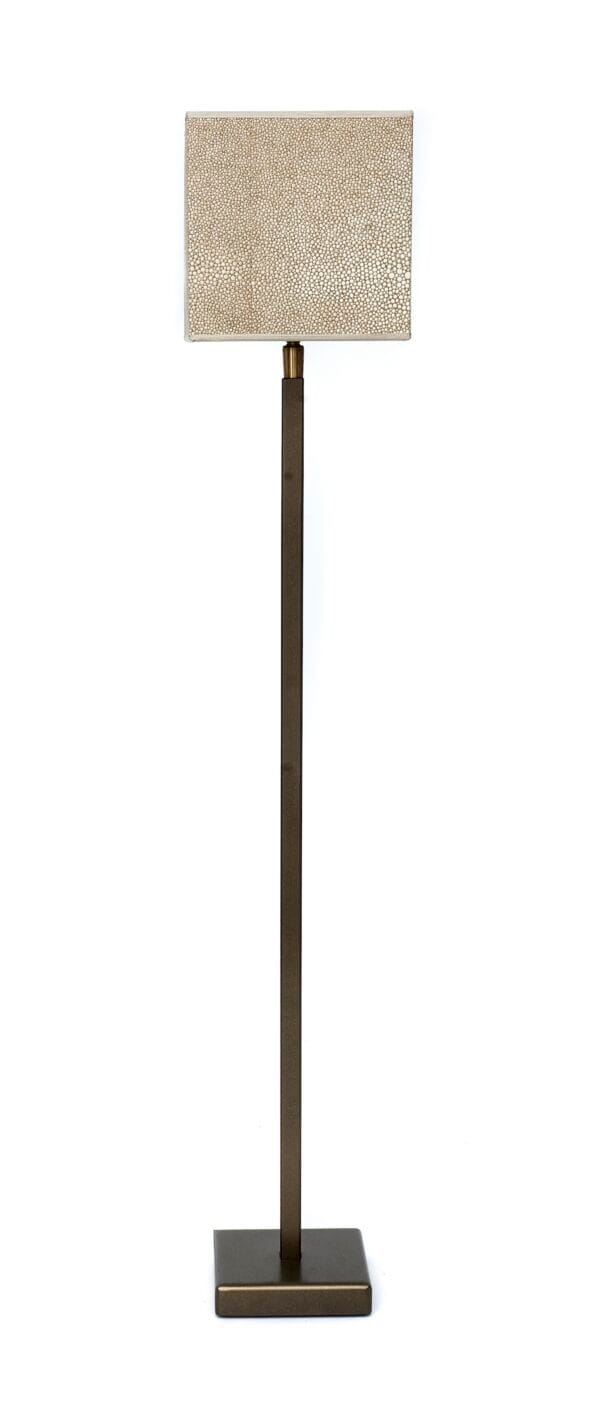 Floor lamp with a tall base and a textured square shade in warm beige tones.