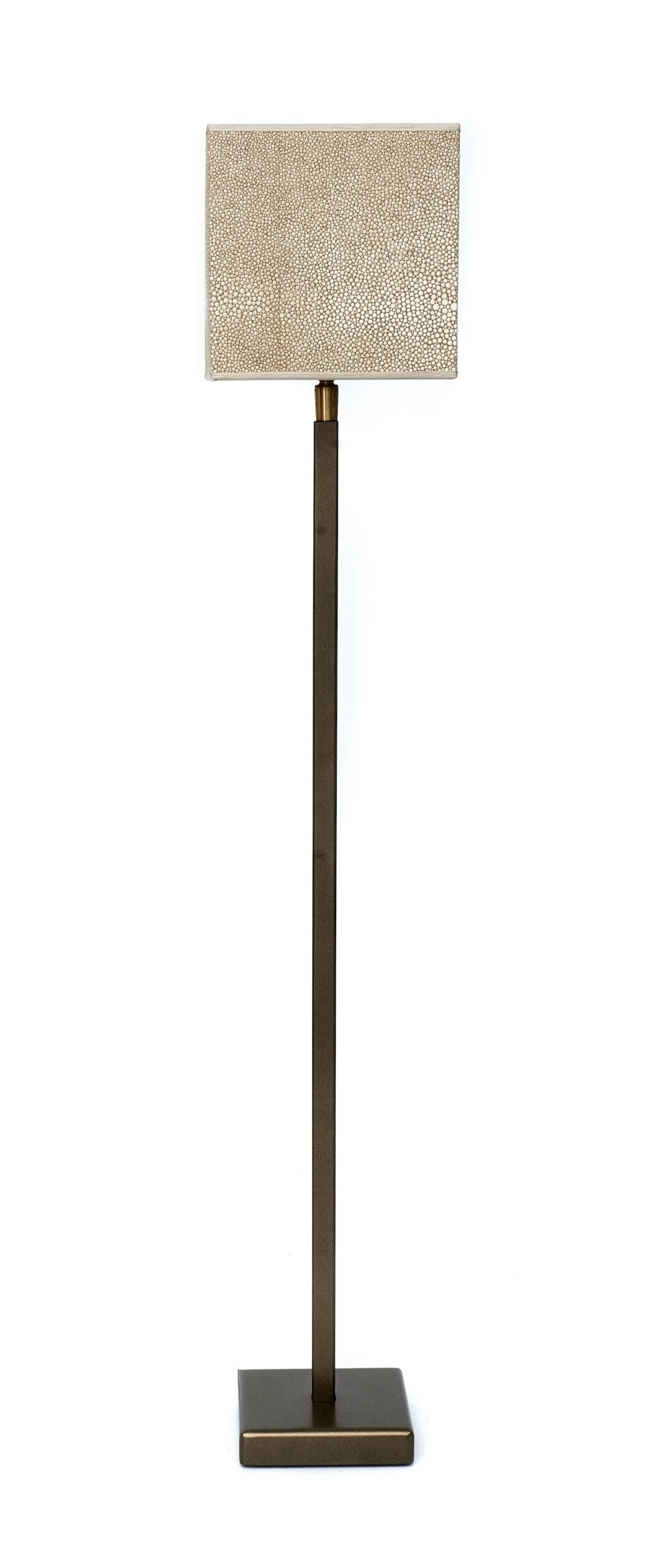 Floor lamp with a tall base and a textured square shade in warm beige tones.