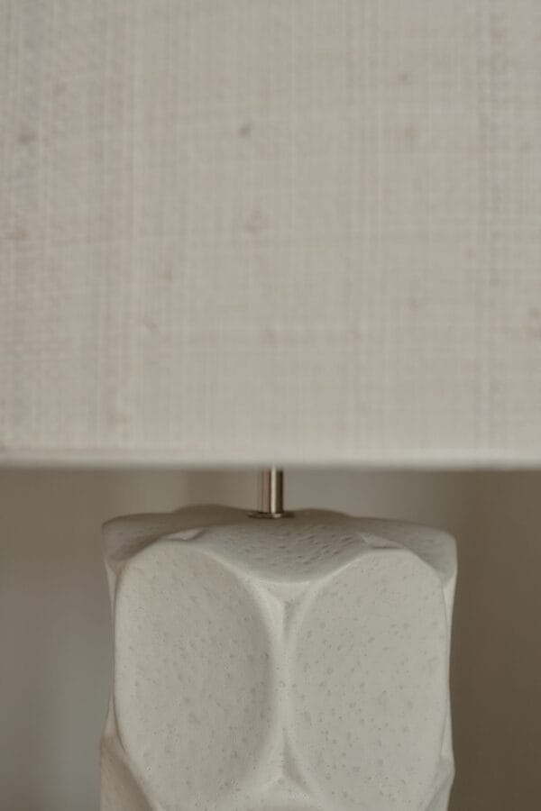 Detail of the Wabi lamp’s organic, embossed ceramic texture.