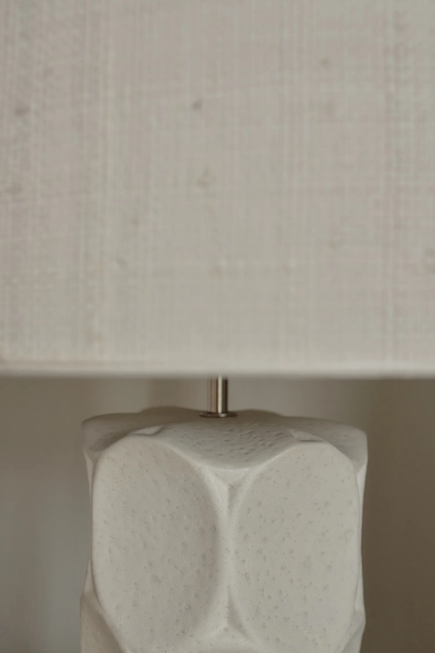 Detail of the Wabi lamp’s organic, embossed ceramic texture.