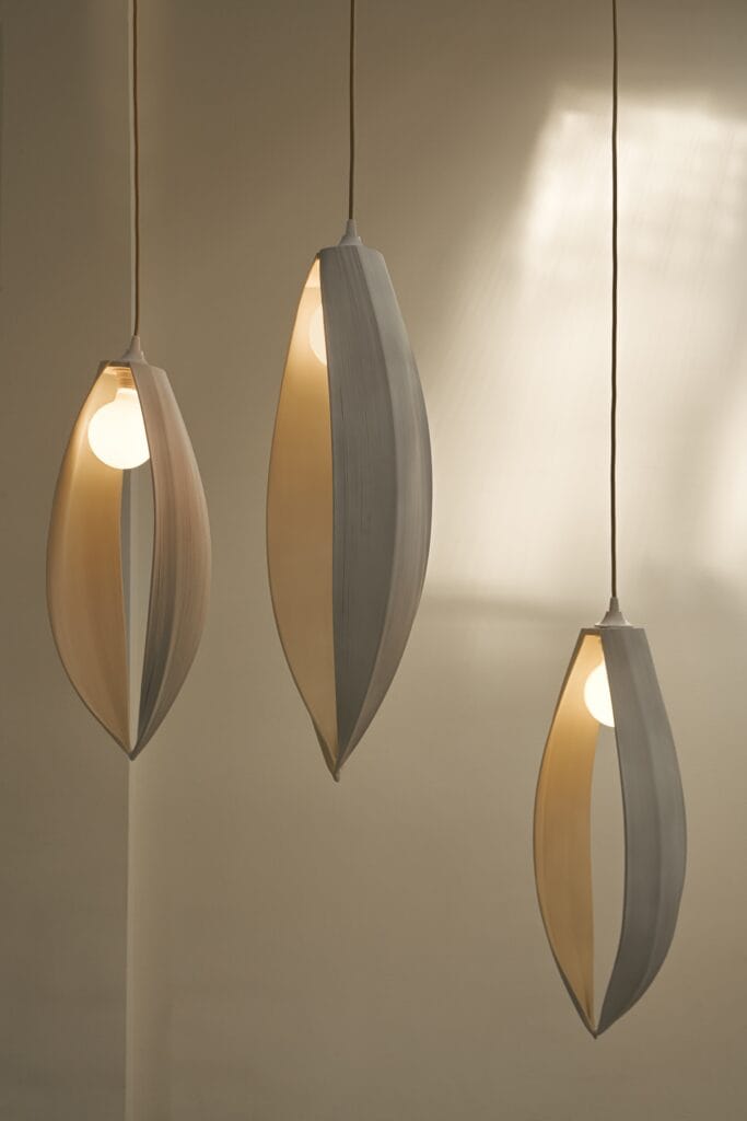 Three sculptural Lora lights with organic, leaf-like forms.