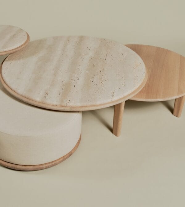 Top view of the Miller Coffee Table Set with travertine, wood, and upholstered pouf elements.